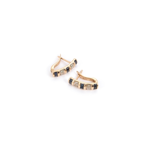 657 - A PAIR OF 9 CARAT GOLD SAPPHIRE AND DIAMOND EARRINGS pairs of calibre-cut sapphires spaced by pairs ... 