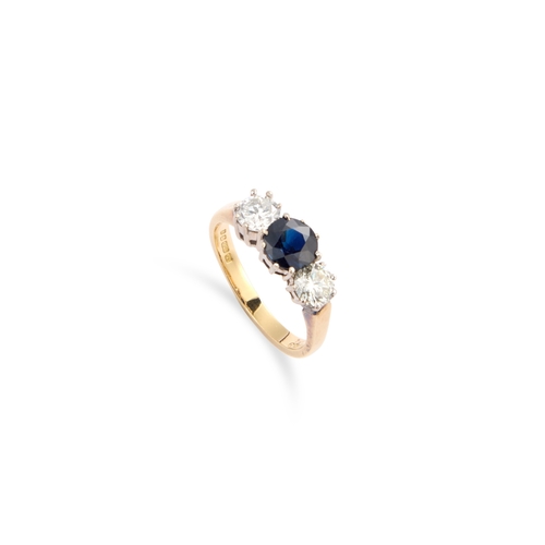 659 - AN 18 CARAT GOLD SAPPHIRE AND DIAMOND THREE STONE RING a round-cut sapphire spaced by round brillian... 