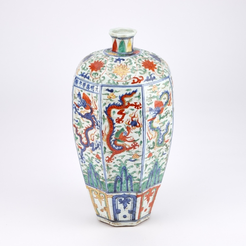 80 - A CHINESE DOUCAI DECORATED PORCELAIN 'DRAGONS' VASE the eight-sided tapering body with a short neck ... 