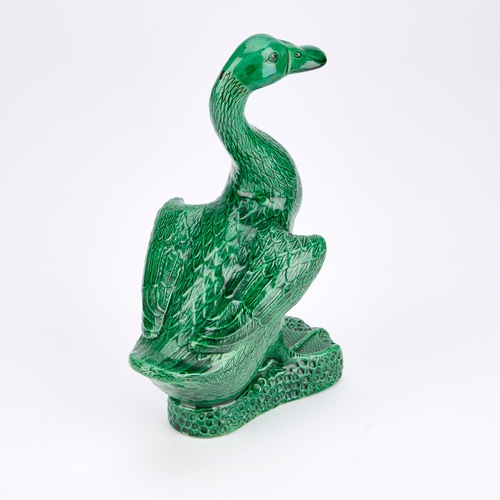 84 - A CHINESE GREEN-GLAZED MODEL OF A DUCK 24cm high