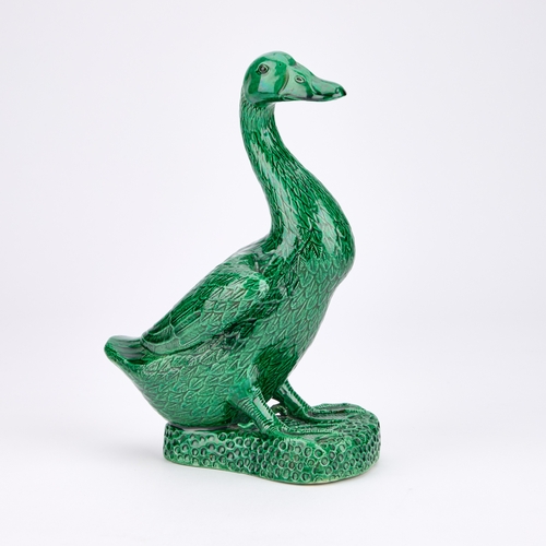 84 - A CHINESE GREEN-GLAZED MODEL OF A DUCK 24cm high