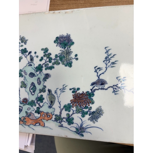 86 - A CHINESE PORCELAIN PLAQUE rectangular, painted with quails amidst rockwork and flowering boughs. 20... 