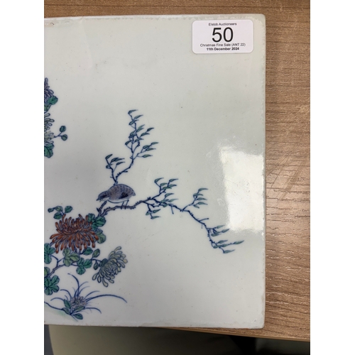 86 - A CHINESE PORCELAIN PLAQUE rectangular, painted with quails amidst rockwork and flowering boughs. 20... 