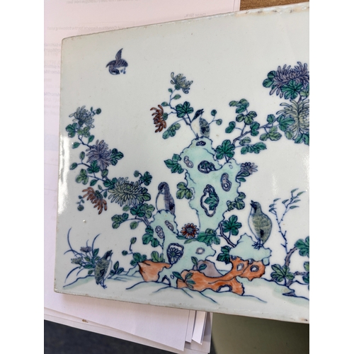 86 - A CHINESE PORCELAIN PLAQUE rectangular, painted with quails amidst rockwork and flowering boughs. 20... 