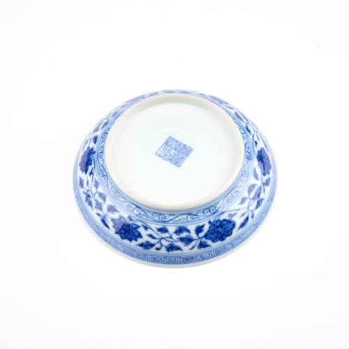 95 - A CHINESE BLUE AND WHITE PORCELAIN DISH IN MING STYLE, LATE QING DYNASTY circular with rounded sides... 