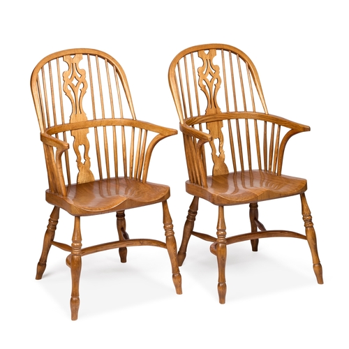 951 - A PAIR OF 20TH CENTURY OAK AND ELM WINDSOR ARMCHAIRS each with a pierced and shaped splat above a sh... 