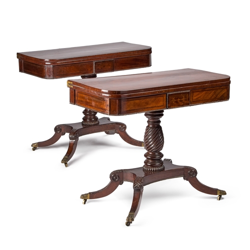 953 - A PAIR OF REGENCY ROSEWOOD CROSSBANDED MAHOGANY CARD TABLES each with a spirally reeded stem above a... 