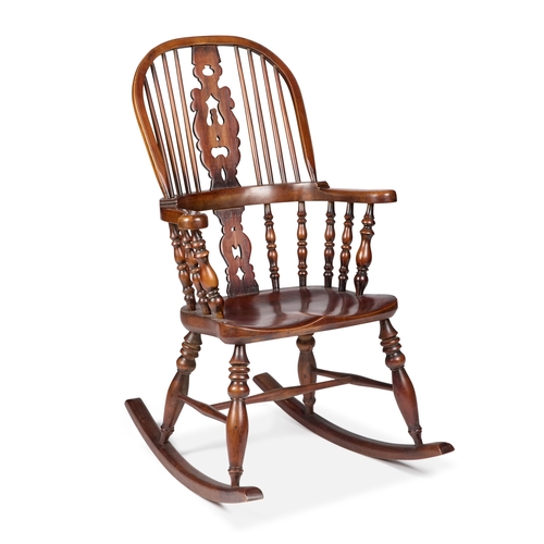 964 - AN OAK AND ELM BROADARM WINDSOR ROCKING CHAIR with a high-back and baluster legs. Height of back 116... 