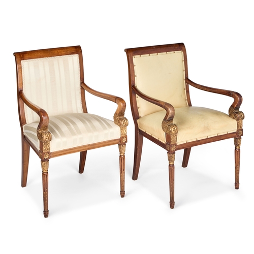 965 - A PAIR OF EMPIRE STYLE PARCEL-GILT MAHOGANY FAUTEUILS each upholstered in striped fabric, the arms w... 