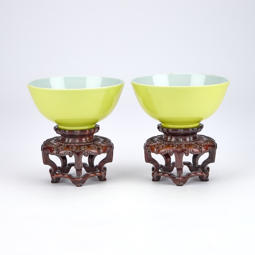 97 - A PAIR OF CHINESE FAMILLE ROSE PORCELAIN BOWLS WITH YELLOW GROUND circular with rounded sides, ename... 