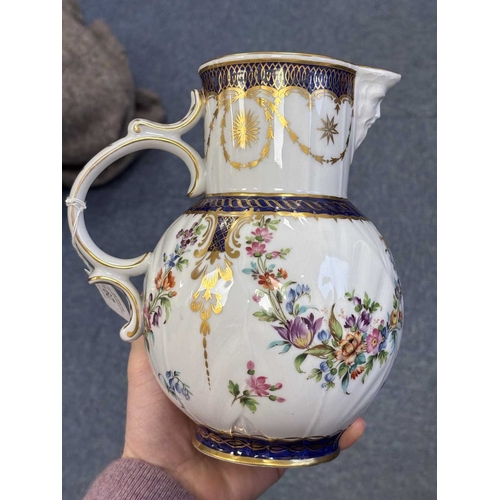 100 - TWO 18TH CENTURY GERMAN PORCELAIN CUPS AND SAUCERS painted with flowers; together with a French porc... 