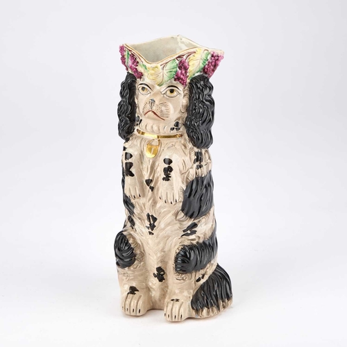 117 - A VICTORIAN STAFFORDSHIRE POTTERY 'BEGGING SPANIEL' JUG CIRCA 1850 modelled sitting upright with fro... 