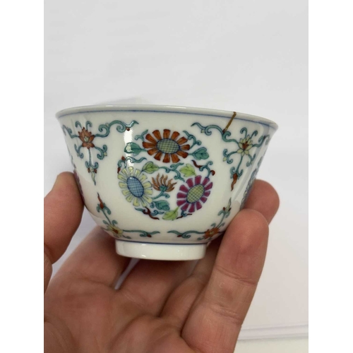 166 - A CHINESE DOUCAI 'CHRYSANTHEMUM' BOWL enamel painted with four medallions of chrysanthemum sprays, s... 