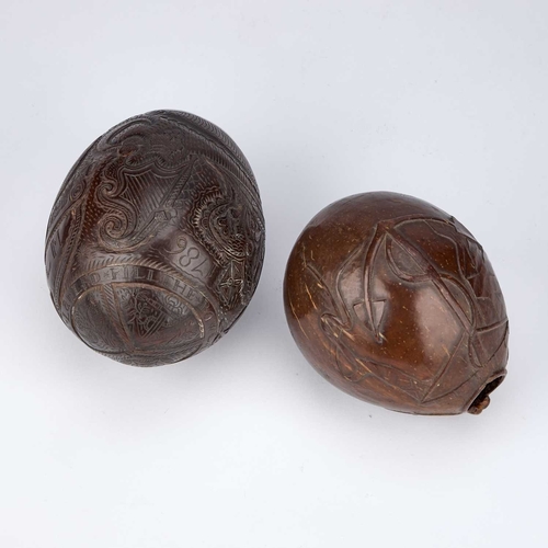 28 - TWO CARVED COCONUT 'BUGBEARS' 18TH/ 19TH CENTURY each with a characteristic grotesque 'face' carved ... 