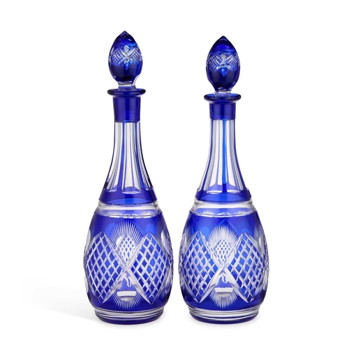 81 - A PAIR OF BOHEMIAN BLUE FLASH GLASS DECANTERS AND STOPPERS (2) 36cm high