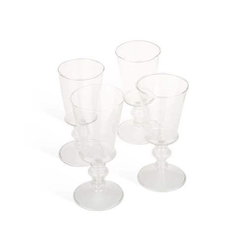 83 - FOUR VENETIAN WINE GLASSES BY SALVIATI & CO each with a deep bucket bowl, a knurled band at the base... 