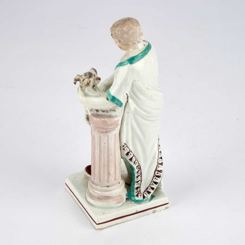 96 - A STAFFORDSHIRE PEARLWARE FIGURE OF SACRIFICE modelled as Jason sacrificing a goat kid on a fluted c... 