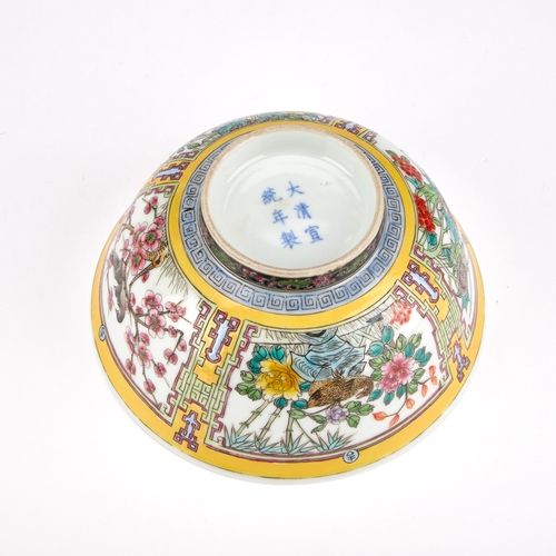 140 - A CHINESE PORCELAIN BOWL WITH A YELLOW GROUND 14.5cm diameter