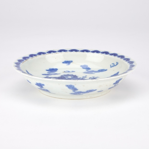 177 - A CHINESE BLUE AND WHITE DRAGON DISH 22cm diameter