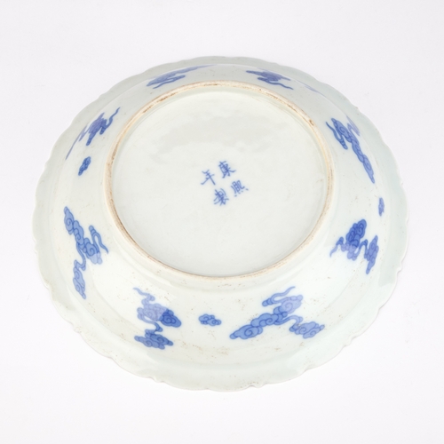 177 - A CHINESE BLUE AND WHITE DRAGON DISH 22cm diameter