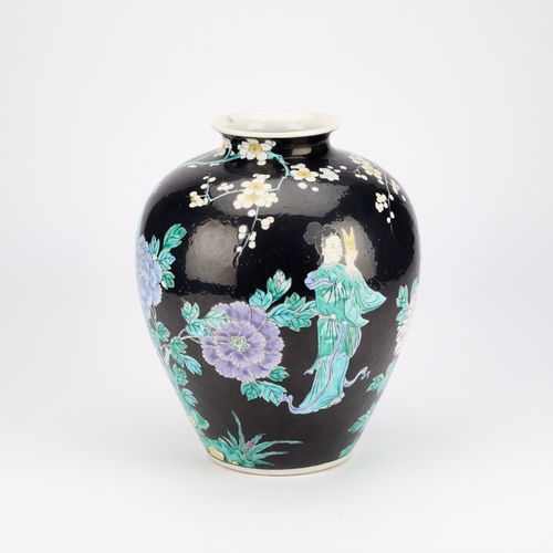 194 - A LARGE CHINESE FAMILLE NOIRE VASE enamel painted with figures, phoenix and flowers, indistinct iron... 