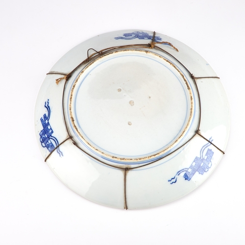 213 - A JAPANESE BLUE AND WHITE CHARGER early 20th Century. 36cm diameter