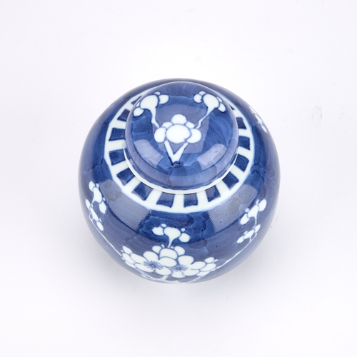 216 - A CHINESE BLUE AND WHITE PRUNUS GINGER JAR AND COVER 12cm high