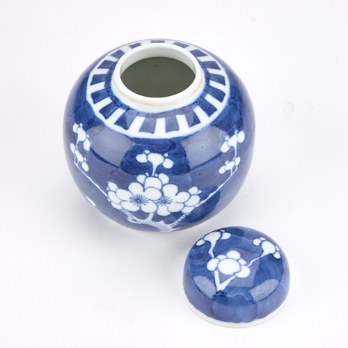 216 - A CHINESE BLUE AND WHITE PRUNUS GINGER JAR AND COVER 12cm high