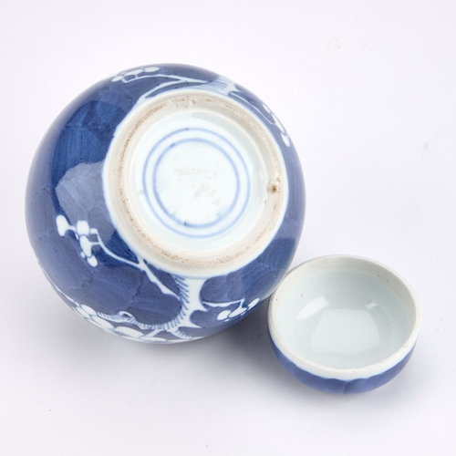 216 - A CHINESE BLUE AND WHITE PRUNUS GINGER JAR AND COVER 12cm high