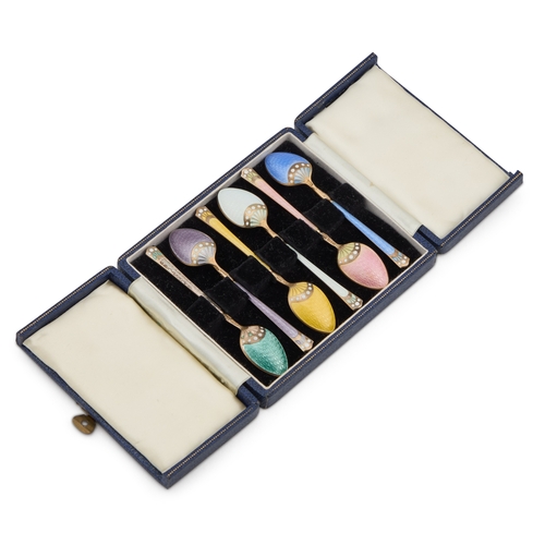 303 - A SET OF SIX NORWEGIAN SILVER-GILT AND ENAMEL COFFEE SPOONS early 20th Century, cased. 9.5cm long, 1... 