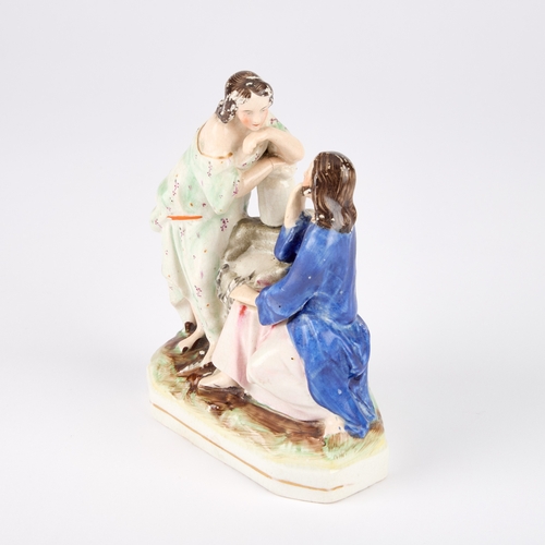 64 - A VICTORIAN STAFFORDSHIRE POTTERY FIGURE GROUP modelled as Jesus and the Samaritan Woman at the well... 