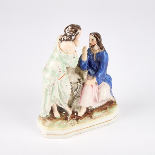 64 - A VICTORIAN STAFFORDSHIRE POTTERY FIGURE GROUP modelled as Jesus and the Samaritan Woman at the well... 