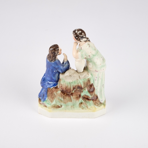 64 - A VICTORIAN STAFFORDSHIRE POTTERY FIGURE GROUP modelled as Jesus and the Samaritan Woman at the well... 