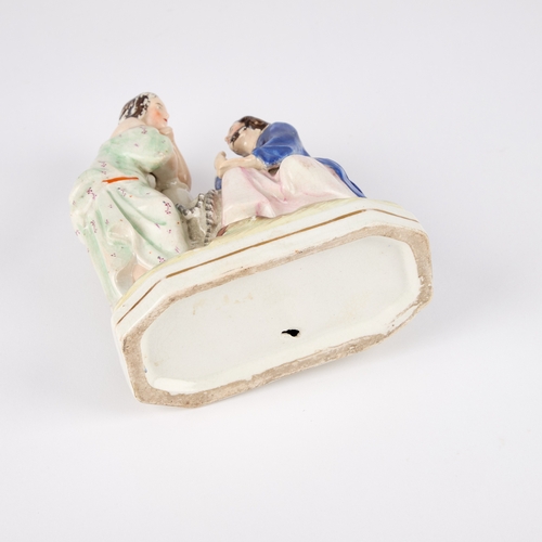 64 - A VICTORIAN STAFFORDSHIRE POTTERY FIGURE GROUP modelled as Jesus and the Samaritan Woman at the well... 