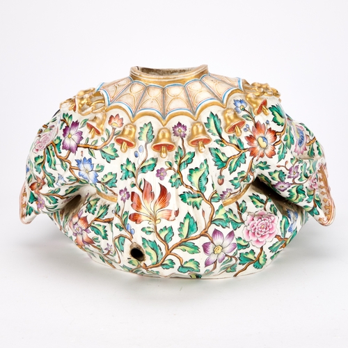 87 - A 19TH CENTURY CONTINENTAL PORCELAIN PAGODA FIGURE BASE IN MEISSEN STYLE modelled seated cross-legge... 