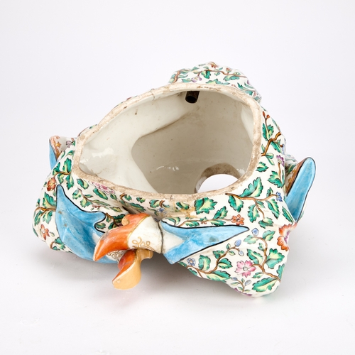 87 - A 19TH CENTURY CONTINENTAL PORCELAIN PAGODA FIGURE BASE IN MEISSEN STYLE modelled seated cross-legge... 