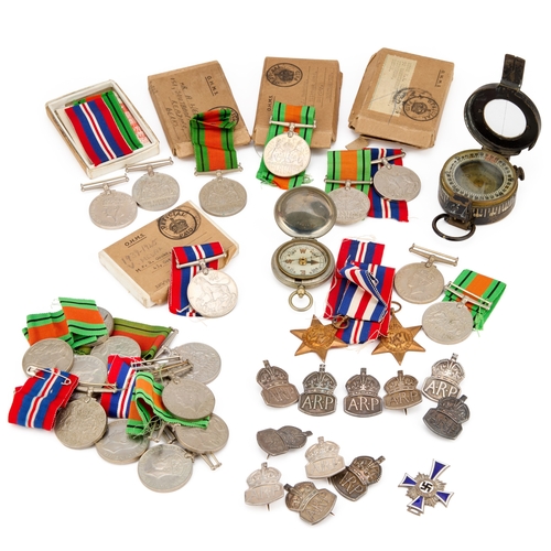 26 - A GROUP OF SECOND WORLD WAR MILITARIA including a German Mother's Cross; silver A.R.P badges; a T.G.... 
