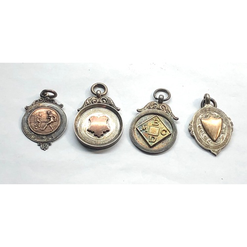 579 - 4 Vintage hallmarked silver fobs