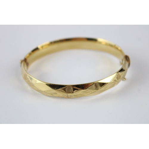 63 - Vintage rolled gold bangle w/ floral engraving