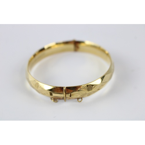 63 - Vintage rolled gold bangle w/ floral engraving