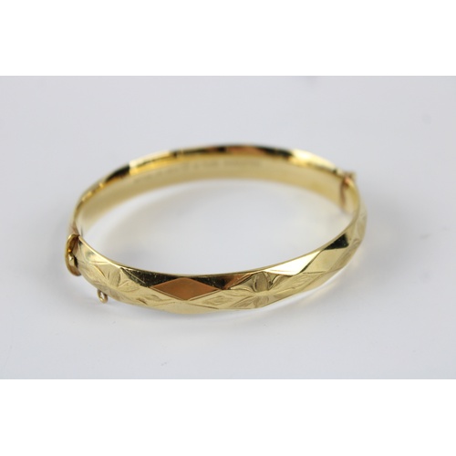 63 - Vintage rolled gold bangle w/ floral engraving