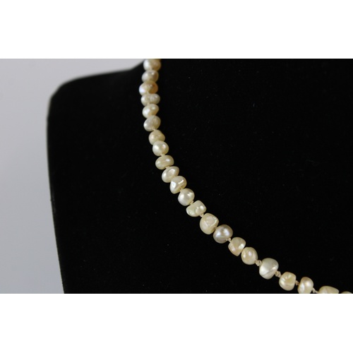 72 - Antique graduated baroque pearl necklace w/ 18ct diamond and ruby set clasp, approx length of neckla... 