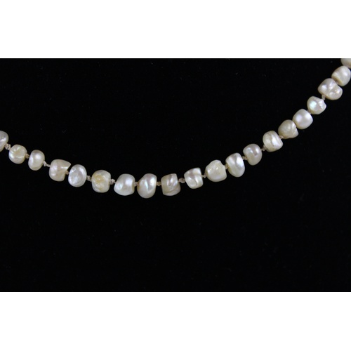 72 - Antique graduated baroque pearl necklace w/ 18ct diamond and ruby set clasp, approx length of neckla... 