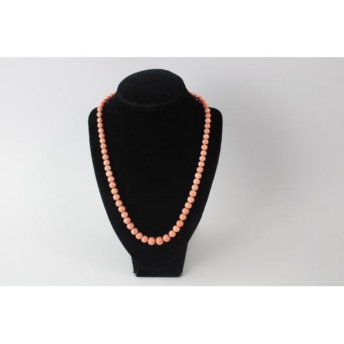 81 - 9ct gold clasped angelskin coral bead necklace (26g), approx length of necklace 17 inches