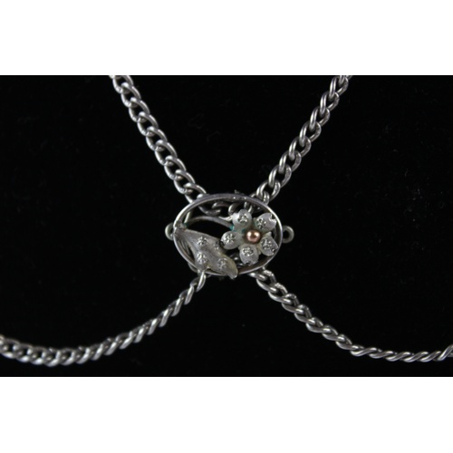 98 - Antique sterling silver guard chain with flower slider (31g)