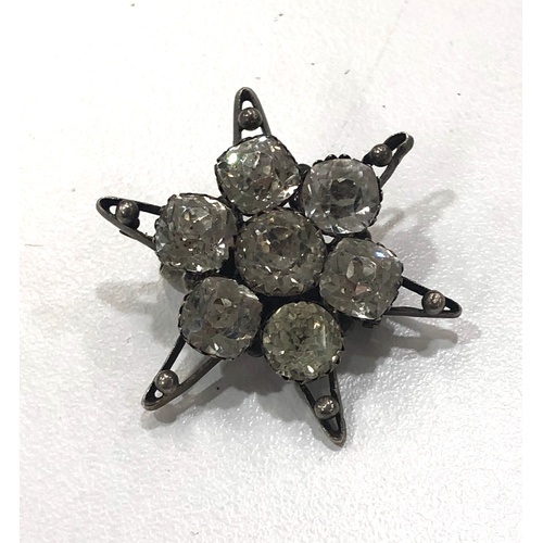 515A - Antique sterling silver paste set starburst brooch