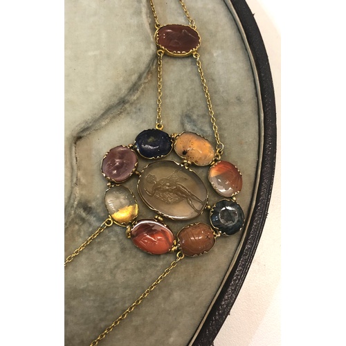 514 - Antique hardstone and gold Intalglio necklace with matching brooch in original fitted case, labelled... 