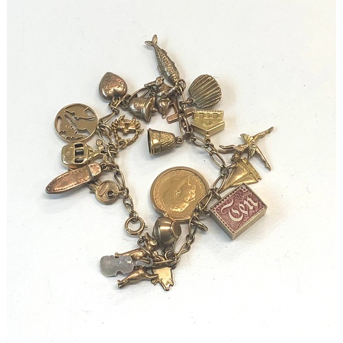 521 - Gold charm bracelet with gold half sovereign total weight 31g