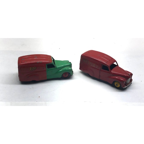 1092 - 2 dinky austin vans 470 in good condition age related wear and marks