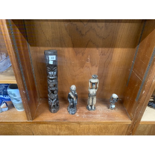 43 - Shelf of african carved figures